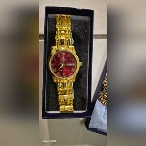 Gold Watch with Red Dial , Stainless Steel , Not A Real POEDAGAR !